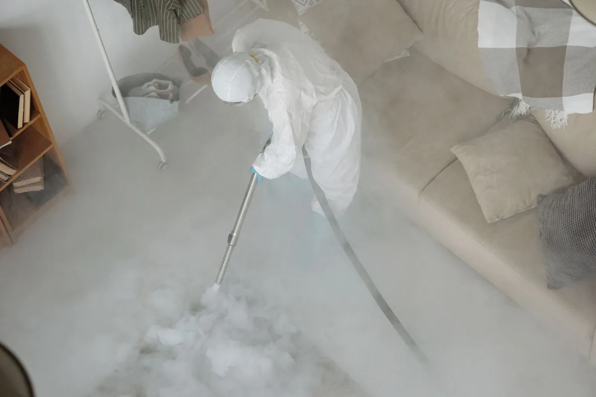 Biohazard cleanup technician in protective equipment, Troy, OH